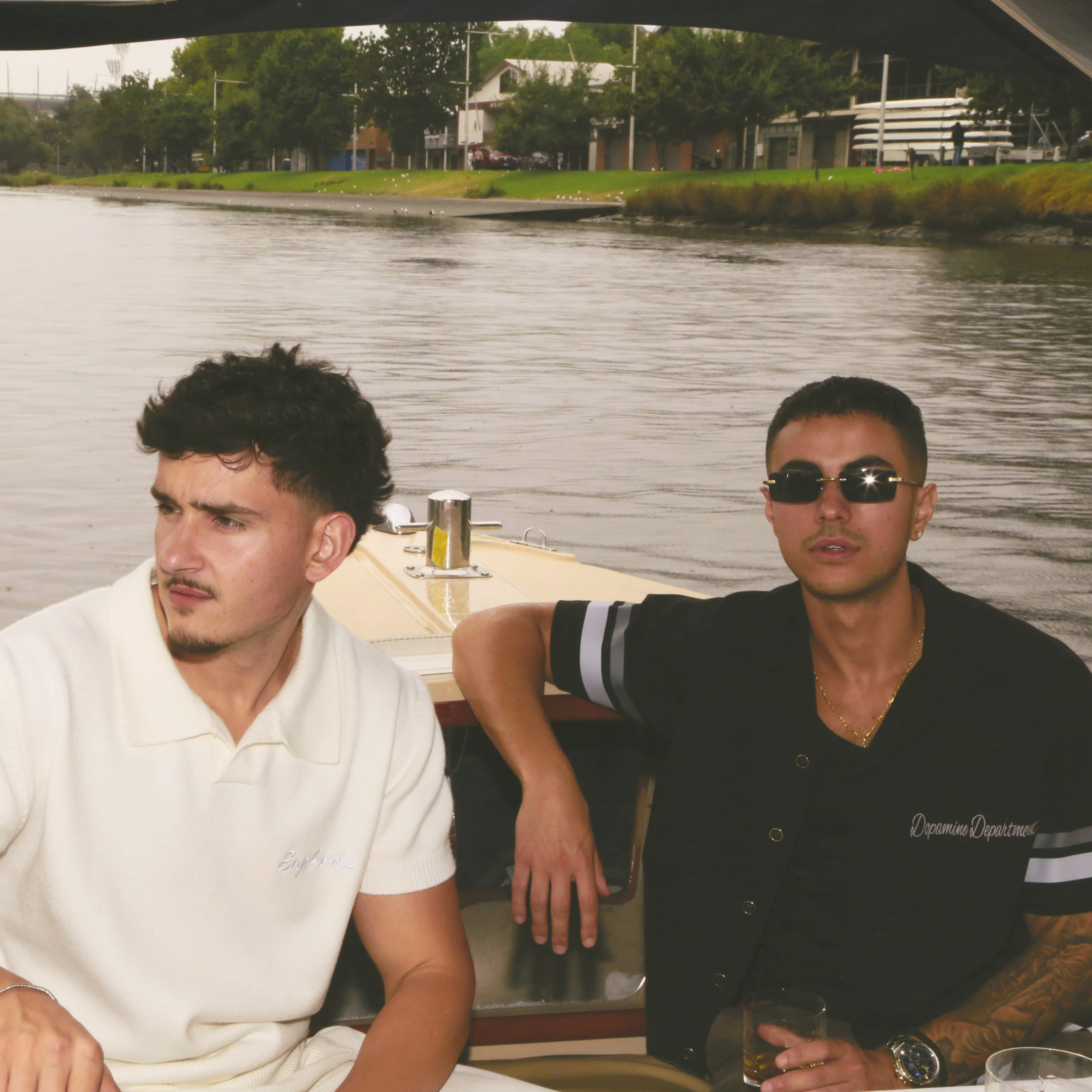 Two models wearing Euphoric clothing on a boat