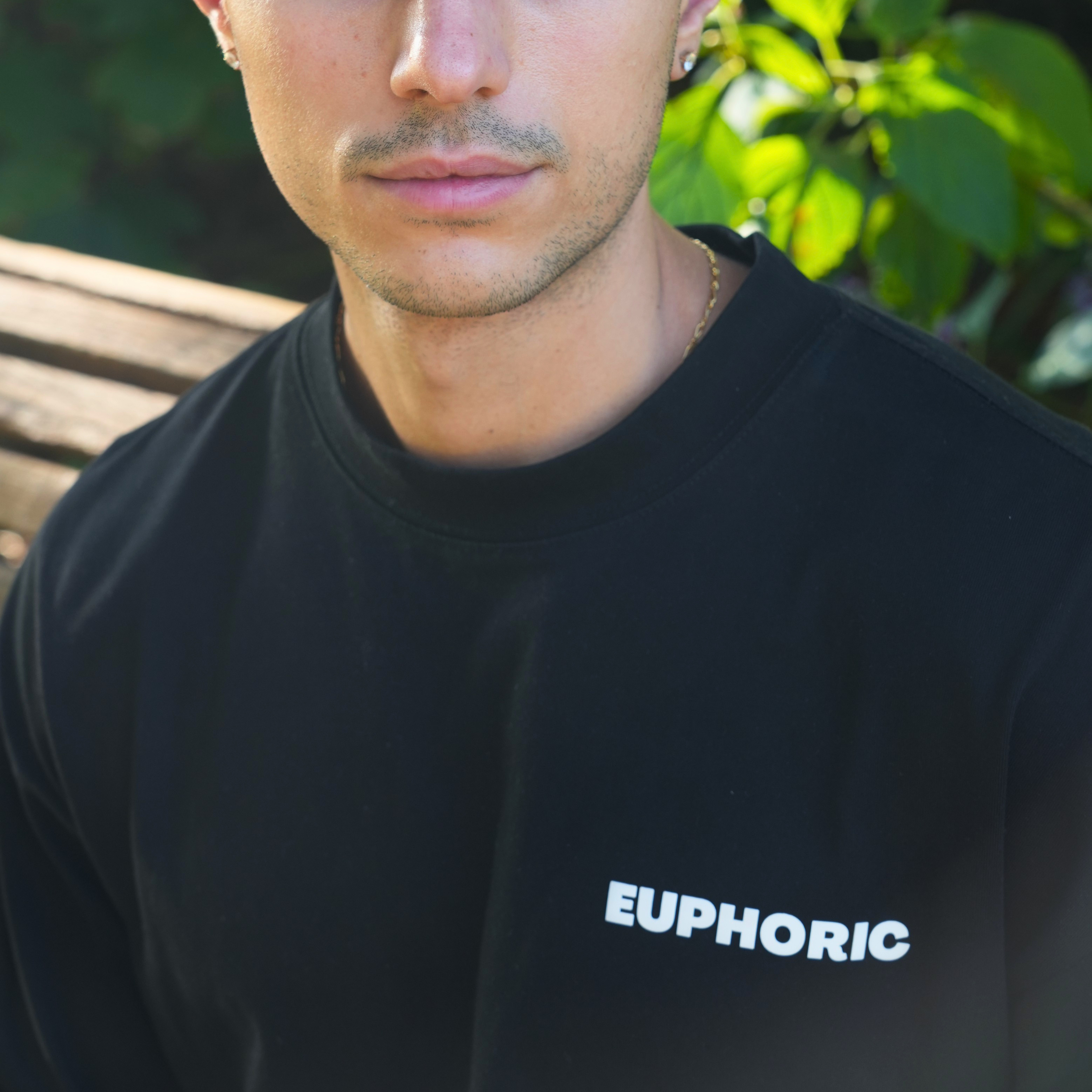 close-up of the euphoric black t-shirt showing the front logo
